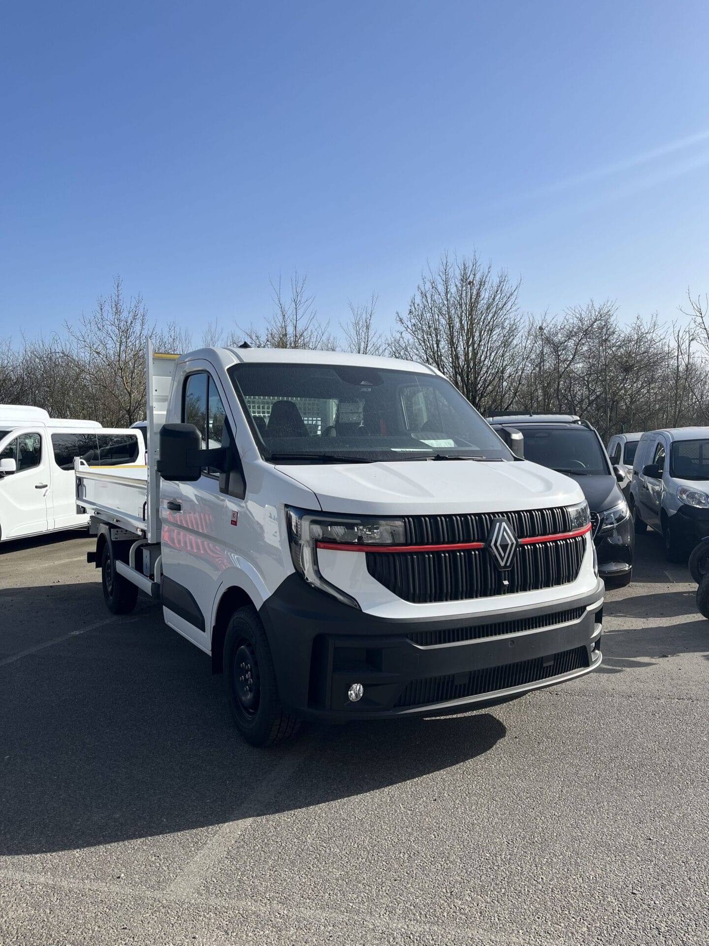 White pickup truck in parking lot.