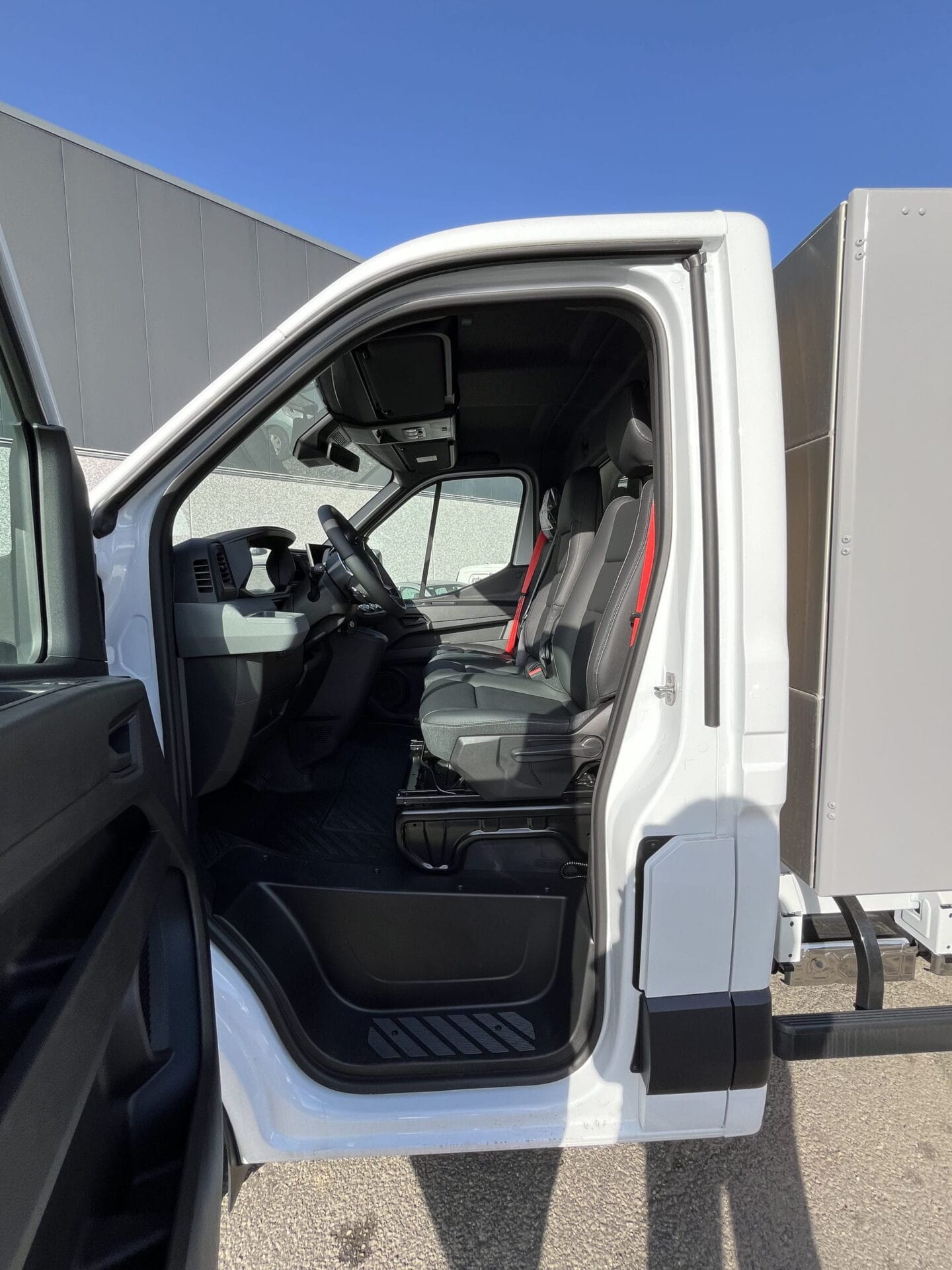 Interior view of a white truck cabin.